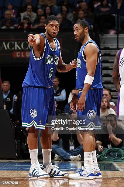 Ryan Gomes and Wayne Ellington of the Minnesota Timberwolves talk on the court during the game against the Phoenix Suns on March 28, 2010 at the...