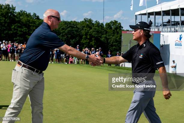 American Family Mutual Insurance Chair and CEO Jack Salwedel congratulates tournament champion Scott McCarron during American Family Insurance...