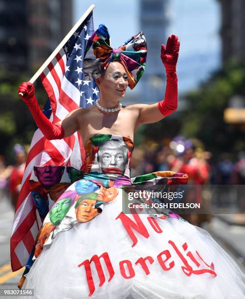 Khuong Lam wears a Donald Trump-themed dress while marching during the San Francisco gay pride parade in San Francisco, California on June 2018.