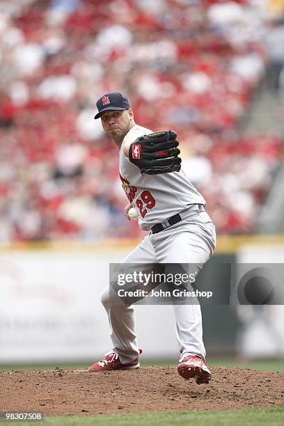 Chris Carpenter of the St. Louis Cardinals delivers a pitch during the game between the St. Louis Cardinals and the Cincinnati Reds at Great American...