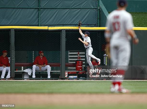 Colby Rasmus of the St. Louis Cardinals steals a home run during the game between the St. Louis Cardinals and the Cincinnati Reds at Great American...