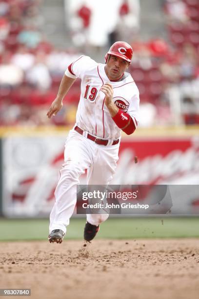 Joey Votto of the Cincinnati Reds runs to third base during the game between the St. Louis Cardinals and the Cincinnati Reds at Great American Ball...