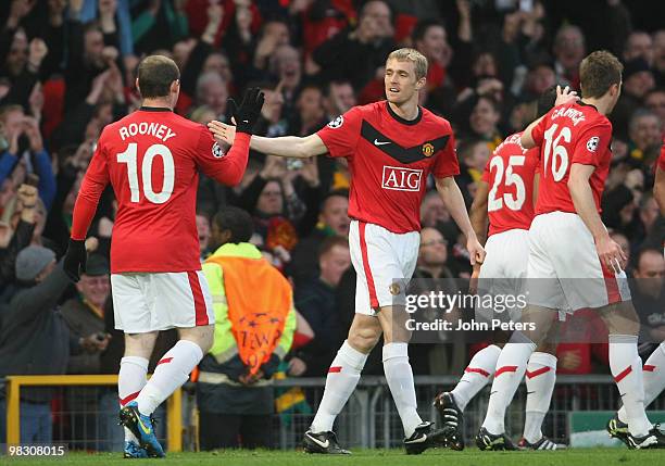 Wayne Rooney and Darren Fletcher of Manchester United celebrate Nani scoring their second goal during the UEFA Champions League Quarter-Final Second...