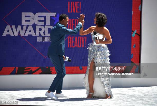 Hosts Terrence J and Cassie speak onstage at Live! Red! Ready! Pre-Show, sponsored by Nissan, at the 2018 BET Awards at Microsoft Theater on June 24,...