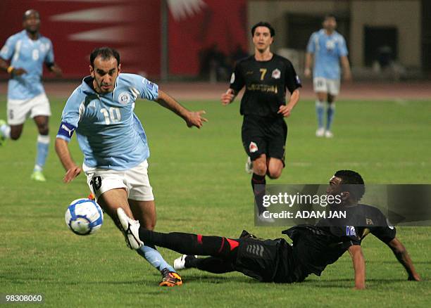 Bahraini Rifaa's Hussein Salman is challenged by Qatari Al-Rayyan's Abdul Hussein Salem during their 2010 AFC Cup group E football match at the...