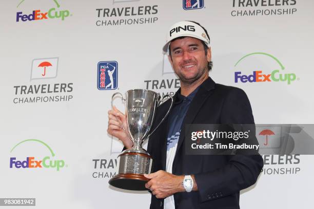 Bubba Watson of the United States poses with the trophy after winning the Travelers Championship at TPC River Highlands on June 24, 2018 in Cromwell,...