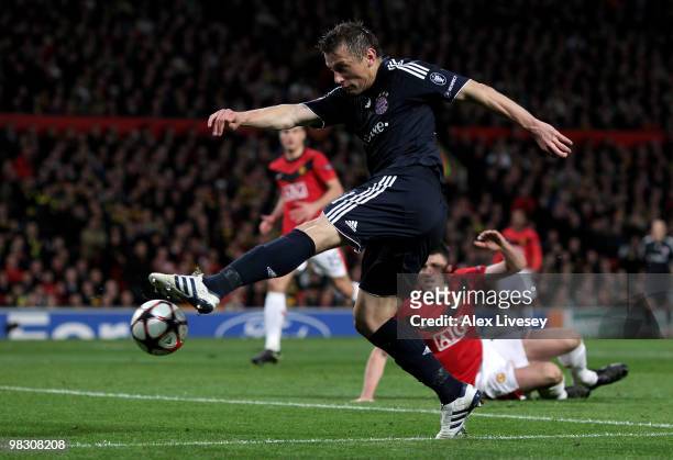 Ivica Olic of Bayern Muenchen scores his team's first goal during the UEFA Champions League Quarter Final second leg match between Manchester United...