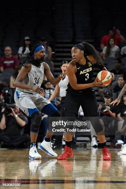 Kelsey Bone of the Las Vegas Aces handles the ball against Sylvia Fowles of the Minnesota Lynx on June 24, 2018 at the Mandalay Bay Events Center in...