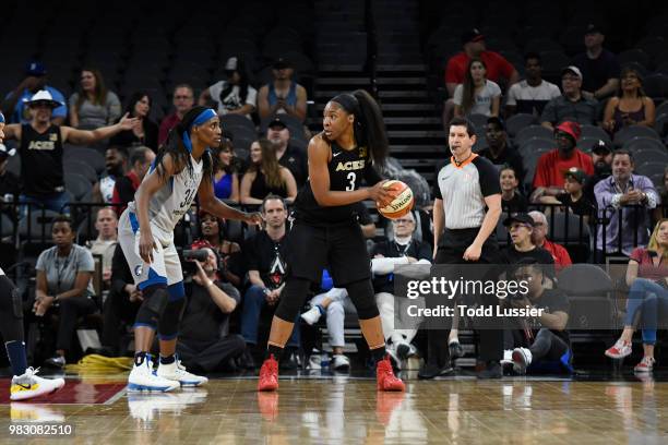 Kelsey Bone of the Las Vegas Aces handles the ball against Sylvia Fowles of the Minnesota Lynx on June 24, 2018 at the Mandalay Bay Events Center in...