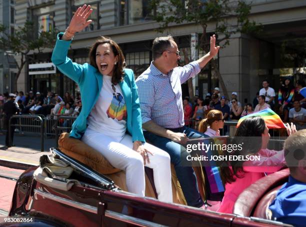 Senator Kamala Harris waves to a cheering crowd during the San Francisco gay pride parade in San Francisco, California on June 2018.