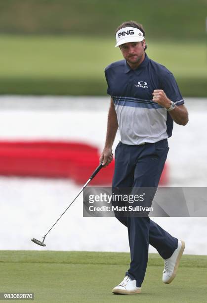 Bubba Watson of the United States pumps his fist after making a birdie on the 15th hole during the final round of the Travelers Championship at TPC...