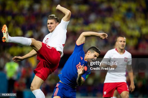 Grzegorz Krychowiak of Poland vies James Rodriguez of Colombia during the Russia 2018 World Cup Group H football match between Poland and Colombia at...