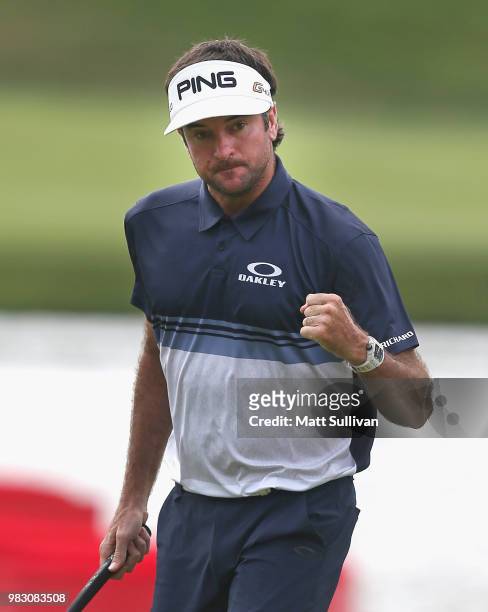Bubba Watson of the United States pumps his fist after making a birdie on the 15th hole during the final round of the Travelers Championship at TPC...