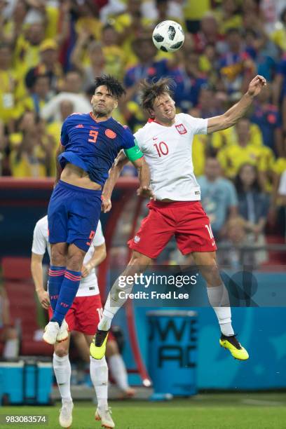 Grzegorz Krychowiak of Poland struggles with his competitor Radamel Falcao of Colombia during the 2018 FIFA World Cup Russia Group H match between...