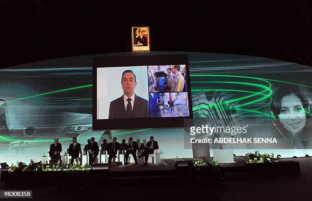 Preisident of Renault Carlos Ghosn appears on a screen during the first 'assises de l'industrie' in Casablanca on April 7, 2010.AFP PHOTO/Abdelhak...
