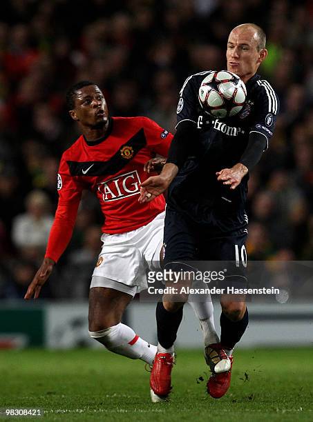 Arjen Robben of Bayern Muenchen competes for the ball with Patrice Evra of Manchester United during the UEFA Champions League Quarter Final second...