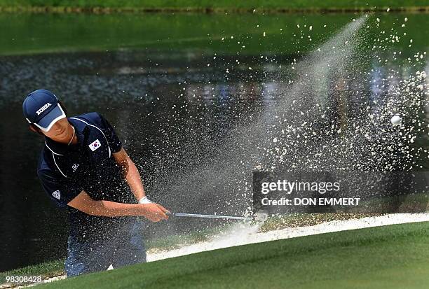 Chang-won Han from Korea hits from a sand trap during the Par-3 contest on April 7, 2010 at the 2010 Masters Tournament at Augusta National Golf...