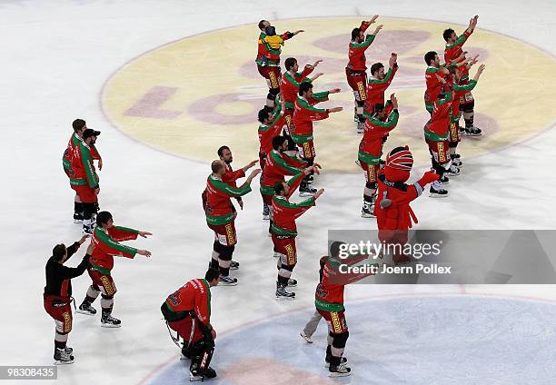 The team of Hannover celebrates after winning the fifth DEL quarter final play-off game between Hannover Scorpions and Thomas Sabo Ice Tigers at TUI...