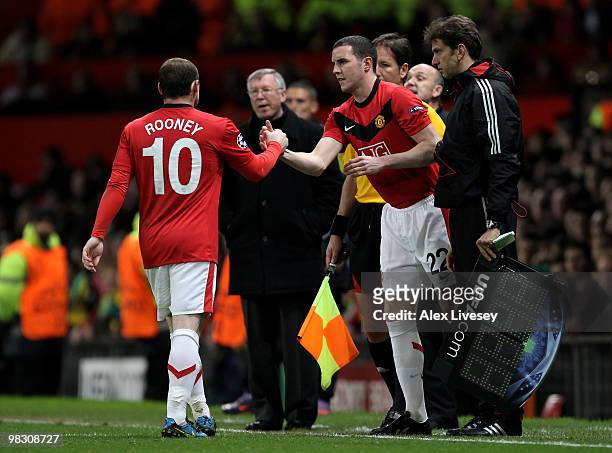 Wayne Rooney of Manchester United is substituted for John O'Shea during the UEFA Champions League Quarter Final second leg match between Manchester...