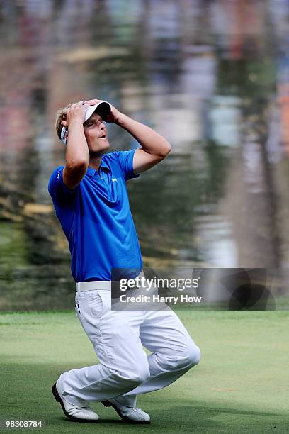 Soren Kjeldsen of Denmark reacts to a missed putt during the Par 3 Contest prior to the 2010 Masters Tournament at Augusta National Golf Club on...