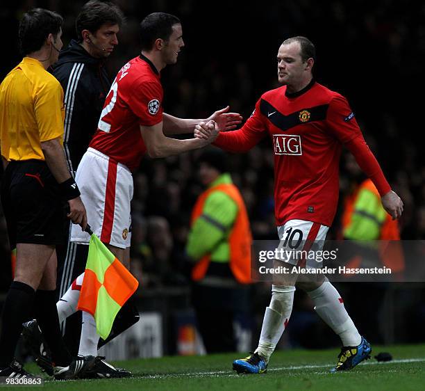 Wayne Rooney of Manchester United is substituted for John O'Shea during the UEFA Champions League Quarter Final second leg match between Manchester...