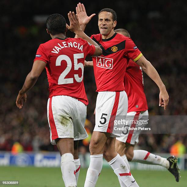 Rio Ferdinand and Antonio Valencia of Manchester United celebrate Nani scoring their third goal during the UEFA Champions League Quarter-Final Second...