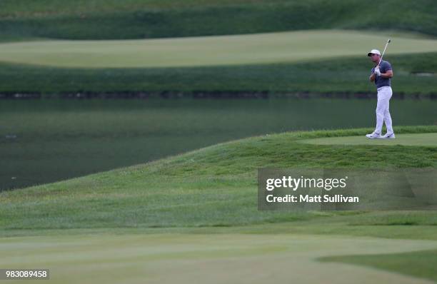 Paul Casey of England hits his third shot on the 17th hole during the final round of the Travelers Championship at TPC River Highlands on June 24,...