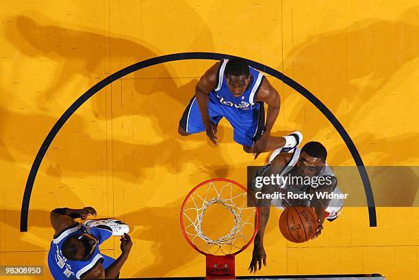 Reggie Williams of the Golden State Warriors shoots a layup against Rodrigue Beaubois and Jason Terry of the Dallas Mavericks during the game at...