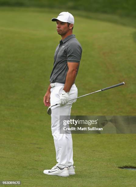 Paul Casey of England watches his fourth shot on the 17th hole during the final round of the Travelers Championship at TPC River Highlands on June...