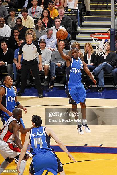 Rodrigue Beaubois of the Dallas Mavericks rebounds during the game against the Golden State Warriors at Oracle Arena on March 27, 2010 in Oakland,...