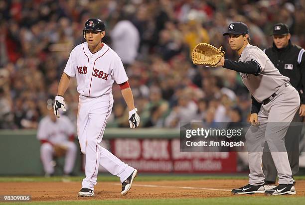 Jacoby Ellsbury leads away from Mark Teixeira of the New York Yankees at Fenway Park on April 6, 2010 in Boston, Massachusetts.