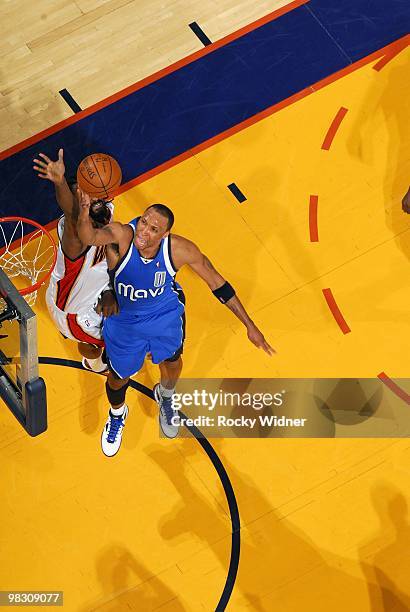 Shawn Marion of the Dallas Mavericks shoots a layup against Ronny Turiaf of the Golden State Warriors during the game at Oracle Arena on March 27,...