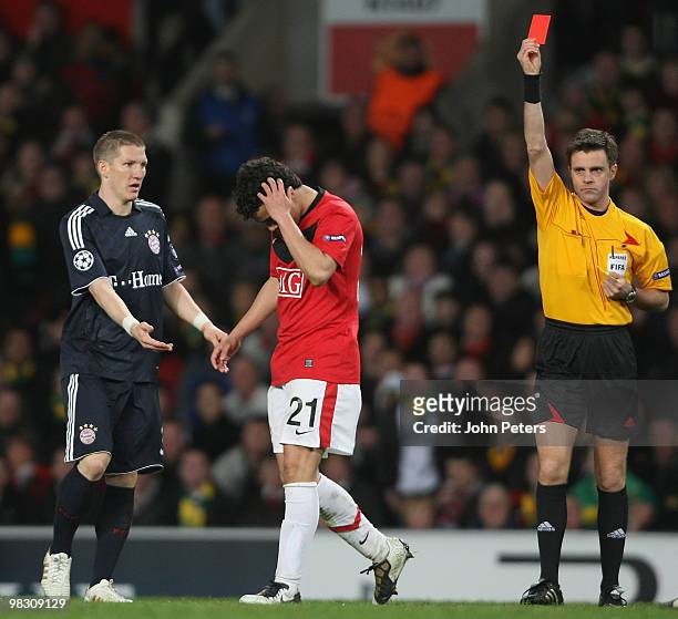 Rafael Da Silva of Manchester United is sent off by referee Nicola Rizzoli during the UEFA Champions League Quarter-Final Second Leg match between...
