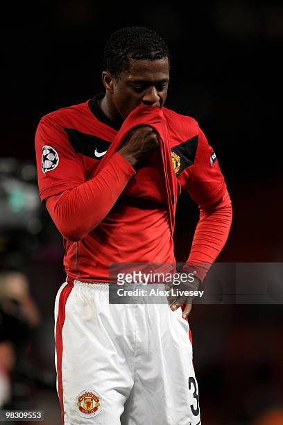 Patrice Evra of Manchester United looks dejected at the end of the UEFA Champions League Quarter Final second leg match between Manchester United and...