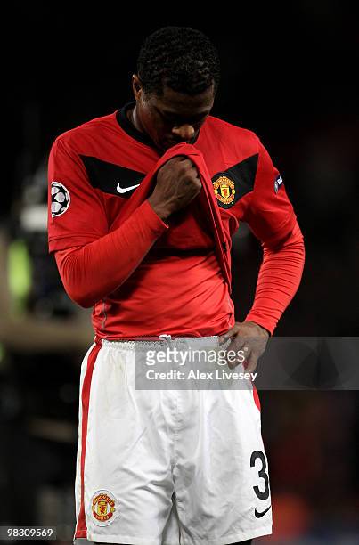 Patrice Evra of Manchester United looks dejected at the end of the UEFA Champions League Quarter Final second leg match between Manchester United and...