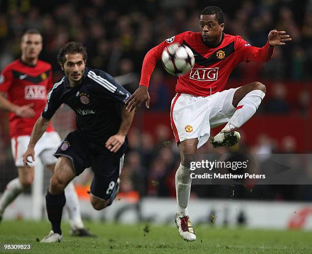 Patrice Evra of Manchester United clashes with Hamit Altintop of Bayern Munich during the UEFA Champions League Quarter-Final Second Leg match...