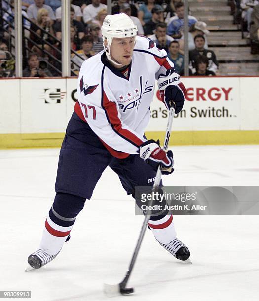 Joe Corvo of the Washington Capitals handles the puck against the Pittsburgh Penguins at Mellon Arena on April 6, 2010 in Pittsburgh, Pennsylvania....
