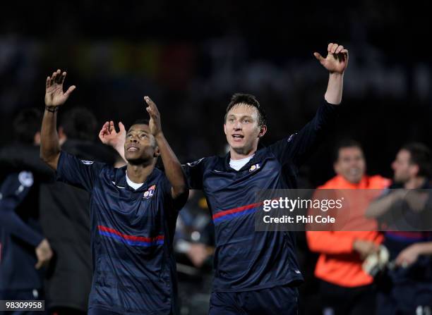 Michel Bastros and Kim Kallstrom of Olympique Lyonnais celebrate going through to the Semi-Finals after the UEFA Champions League quarter final...