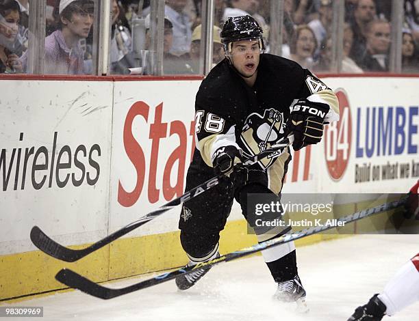 Tyler Kennedy of the Pittsburgh Penguins makes a pass against the Washington Capitals at Mellon Arena on April 6, 2010 in Pittsburgh, Pennsylvania....