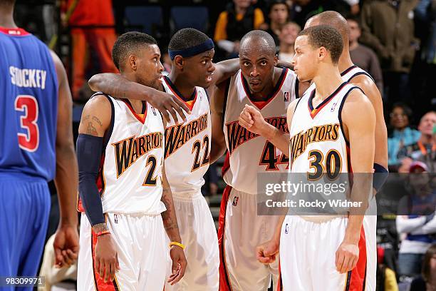 Watson, Anthony Morrow, Anthony Tolliver and Stephen Curry of the Golden State Warriors stand together during the game against the Detroit Pistons on...