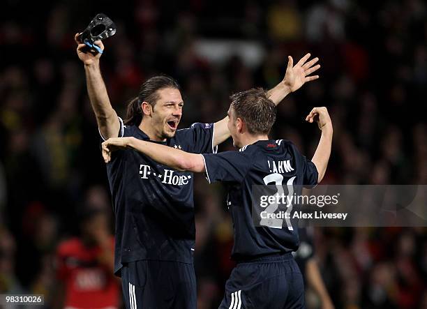 Martin Demichelis of Bayern Muenchen celebrates with team mate Philipp Lahm at the end of the UEFA Champions League Quarter Final second leg match...