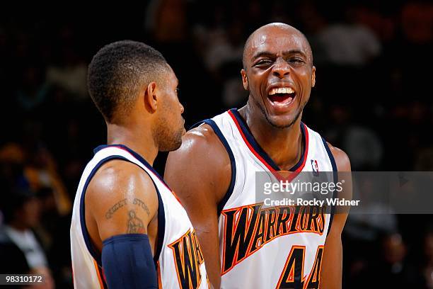 Watson and Anthony Tolliver of the Golden State Warriors share a laugh during the game against the Detroit Pistons on February 27, 2009 at Oracle...
