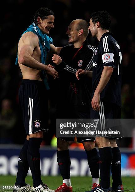 Arjen Robben of Bayern Muenchen celebrates with team mates Daniel Van Buyten and Mark van Bommel at the end of the UEFA Champions League Quarter...