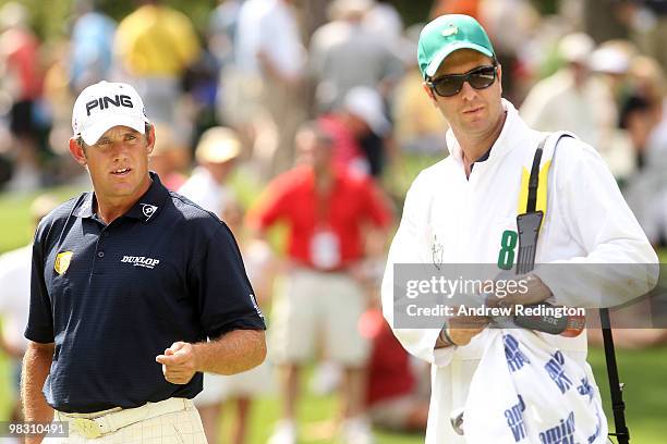 Lee Westwood of England alongside his caddie Michael Vaughn, former England cricket captain during the Par 3 Contest prior to the 2010 Masters...