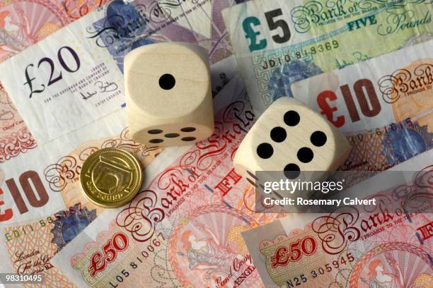 two dice, one and six, pound coin and notes - ten pound note stock pictures, royalty-free photos & images