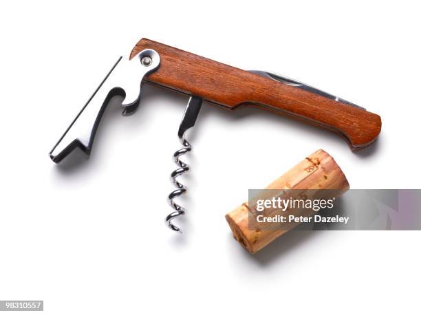 cork screw and wine cork on white background - corkscrew foto e immagini stock