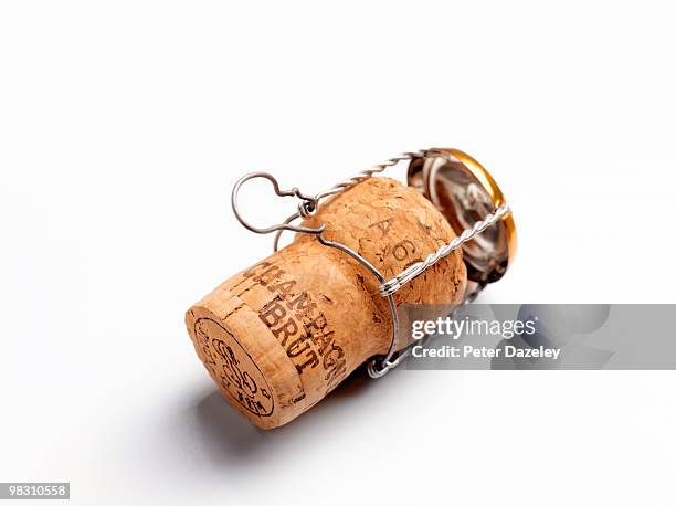 champagne cork on white background with copy space - sektkorken stock-fotos und bilder