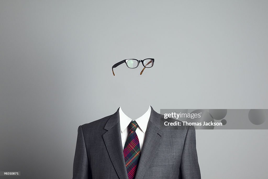 Businessman with no face, looking right