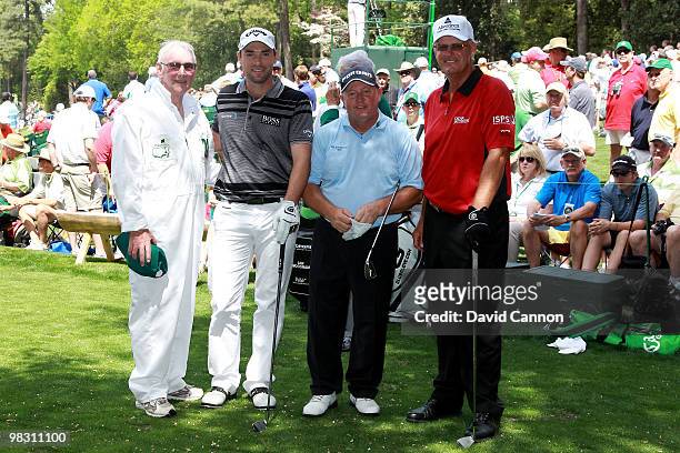 Oliver Wilson of England and his father pose with Ian Woosnam of Wales and Sandy Lyle of Scotland during the Par 3 Contest prior to the 2010 Masters...