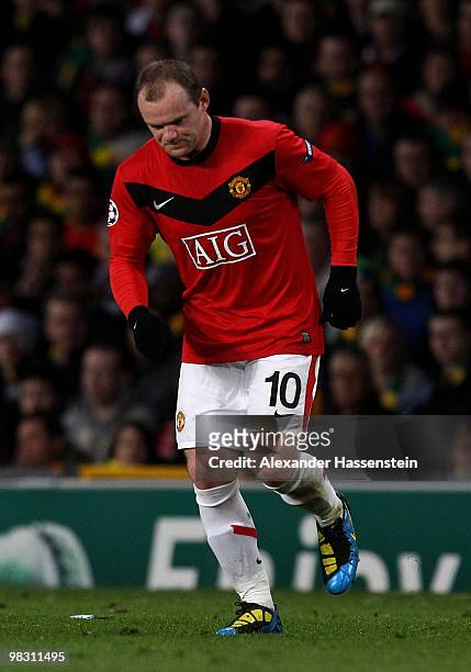 Wayne Rooney of Manchester United hobbles during the UEFA Champions League Quarter Final second leg match between Manchester United and Bayern...
